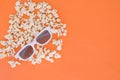 3d glasses and popcorn are isolated on a orange background. Flat lay. Copyspace Royalty Free Stock Photo