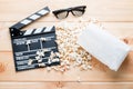 3D glasses, video clapper and delicious popcorn - objects on woo