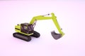 3d graphic model of a yellow construction machine with a bucket. Yellow excavator on a white isolated background. 3D