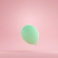 3D green balloon floating on pink background. Royalty Free Stock Photo
