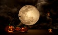 3d halloween pumpkin holiday party with full moon, flying bats, Scared Jack O Lantern and candle light in pumpkin, witch pointed Royalty Free Stock Photo