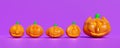 3d halloween pumpkin holiday party with Scared Jack O Lantern and candle light in orange pumpkin isolated on purple background. 3d