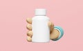 3d hand holding white pill bottle isolated on pink background. mock up template concept, 3d render illustration Royalty Free Stock Photo
