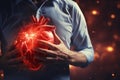 3D hologram of a heart against a human silhouette, studying heart disease using AI, AI in developing treatments for