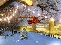 Tallinn Old town  snowy weather  Christmas tree in park illumination  festive city    street people walk bokeh b Royalty Free Stock Photo