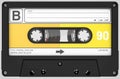 Yellow,white and black audio cassette with sticker and label Royalty Free Stock Photo