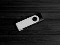3D illustration. Black pendrive isolated on wooden dark background Royalty Free Stock Photo