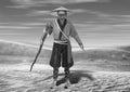 3D Illustration of Black and White Wise Old Traditional Asian Man Walking Through Desert Royalty Free Stock Photo