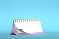 3d illustration of blank pink desk paper calendar on a minimal blue pastel colored background Royalty Free Stock Photo