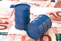 3d illustration: Blue barrels of oil lie on the background of banknote ten Euro, European Union. Money. Petroleum business