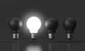 3d illustration - Brightness bulb standing out black bulb, Idea Royalty Free Stock Photo