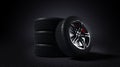 3D illustration of car rim and tyre standing on asphalt