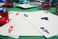 3D illustration casino game. Chips, playing cards for poker. Poker chips, red dice and money on green table. Online Royalty Free Stock Photo