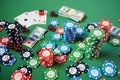 3D illustration casino game. Chips, playing cards for poker. Poker chips, red dice and money on green table. Online