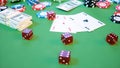 3D illustration casino game. Chips, playing cards for poker. Poker chips, red dice and money on green table. Online