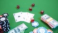 3D illustration casino game. Chips, playing cards for poker. Poker chips, red dice and money on green table. Online