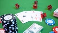 3D illustration casino game. Chips, playing cards for poker. Poker chips, red dice and money on green table. Online Royalty Free Stock Photo