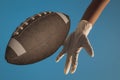 3D illustration of a child\'s hand with a white latex glove playing with a football