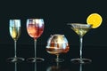 3d illustration of cognac, white wine, red wine, martini glasses lemon slice in row on dark backgroun Royalty Free Stock Photo