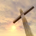 3D illustration conceptual wood cross or religion symbol shape over a sunset sky with clouds background