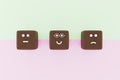 3D illustration of 3 cube shape face emoticons for a survey. Marketing and client satisfation concept. Royalty Free Stock Photo