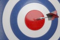 3d illustration. Darts hit blue target background. . It`s like a successful business