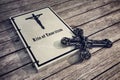 Exorcism book on wooden floor Royalty Free Stock Photo