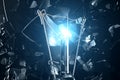 3D illustration Exploding light bulb on a blue background, with concept creative thinking and innovative solutions. Royalty Free Stock Photo