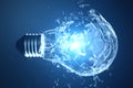 3D illustration Exploding light bulb on a blue background, with concept creative thinking and innovative solutions. Royalty Free Stock Photo