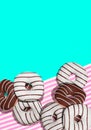 3d illustration fashion collage flat lay scene..Chocolate glaze black and white donuts on pink and blue vanilla background. Donut