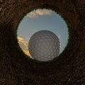 3D illustration of a golf ball going into a hole.