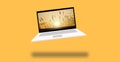 3D illustration graphic of a laptop with beautiful sun rising from the horizon through fields of grass landscape scene.