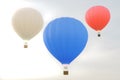 3D illustration hot air balloon on sky background. White, red, blue, green and yellow air ballon flyes on sky. Royalty Free Stock Photo