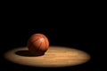 3d illustration illuminated basketball ball over black background
