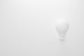 Light bulb white color on white background with copy space