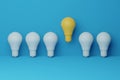 Light bulb yellow floating outstanding among lightbulb light blue on background. Concept of creative idea and Royalty Free Stock Photo