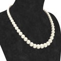 3D illustration macro zoom pearl necklace on a black mannequin