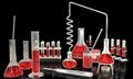 3D illustration of objects - laboratory test tubes with various science glassware with red liquid blood test samples on black Royalty Free Stock Photo