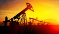 3d illustration of oil pump jacks on sunset background