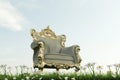 Regal armchair on green field