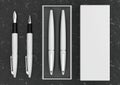 3d illustration render of a writing set. Ball pen and ink pen in a box on a black marble background Royalty Free Stock Photo