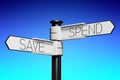 Spend, save - signpost with two arrows Royalty Free Stock Photo