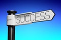 Success - white signpost with one arrow, abstract blue background
