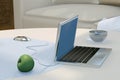 3d illustration of still life with laptop, green apple, tea cup on the table