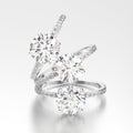 3D illustration three white gold or silver traditional engagement diamond rings with reflection