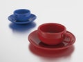 3D illustration two red and blue cups and saucers