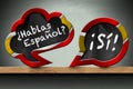 Hablas Espanol and Si - Two Speech Bubbles on Wooden Shelf Royalty Free Stock Photo