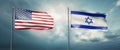 Two state flags of the united states of america and israel, facing each other and moving in the wind in front of c