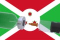 3D Illustration vaccine container bottle accompanied by a syringe with Burundi flag covid19 covid-19 coronavirus