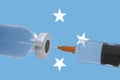 3D Illustration vaccine container bottle accompanied by a syringe with Micronesia flag covid19 covid-19 coronavirus